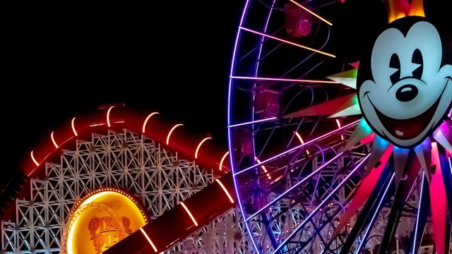 Pixar Pal-A-Round lit up at night in Disneyland California Adventure Park, southern california graduation trips