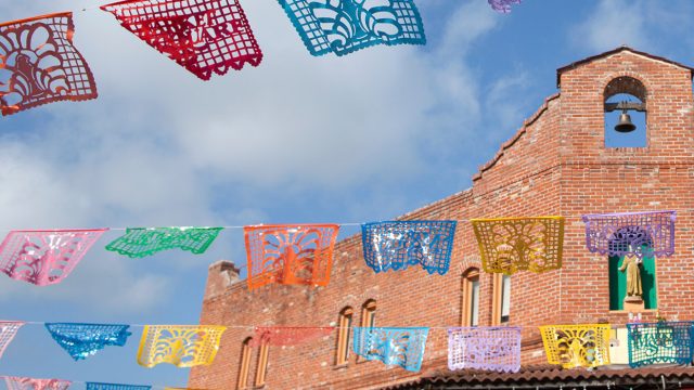 Papel Picado banners hanging throughout Historic Market Square in San Antonio, san antonio performance tours